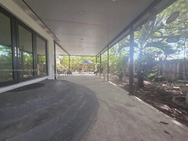 a view of a room with large windows