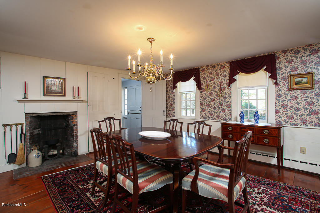 82 Chestnut Hill Loop Montague, MA 01351 - Photo 12 of 36 a view of a dining room with furniture and a fireplace