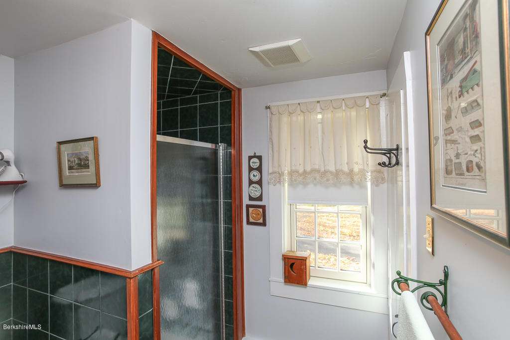 82 Chestnut Hill Loop Montague, MA 01351 - Photo 15 of 36 a bathroom with a bathtub and shower