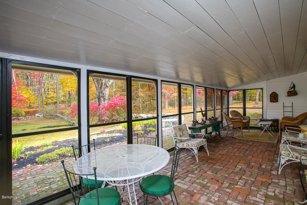 82 Chestnut Hill Loop Montague, MA 01351 - Photo 20 of 36 a living room with furniture and floor to ceiling windows