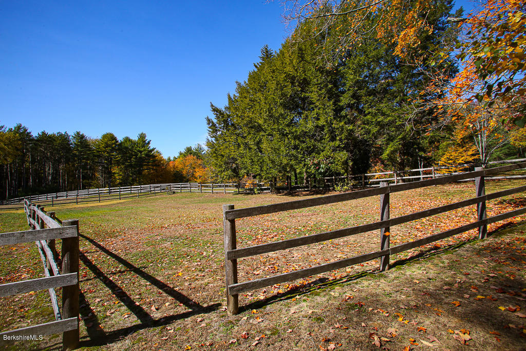 82 Chestnut Hill Loop Montague, MA 01351 - Photo 32 of 36 a view of a tennis court with wooden fence