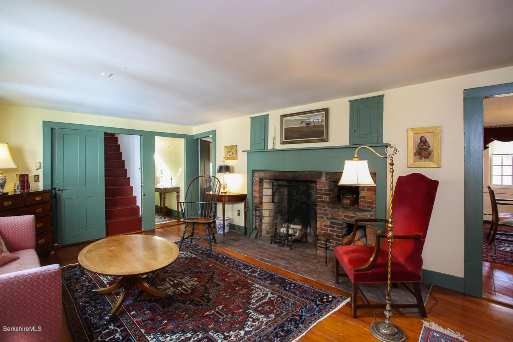 82 Chestnut Hill Loop Montague, MA 01351 - Photo 10 of 36 a living room with furniture and a fireplace