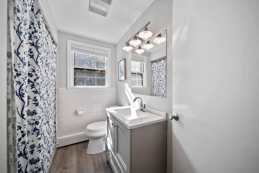 13 Rattlesnake Hill Road Andover, MA 01810 - Photo 11 of 25 a bathroom with a sink a toilet and a mirror