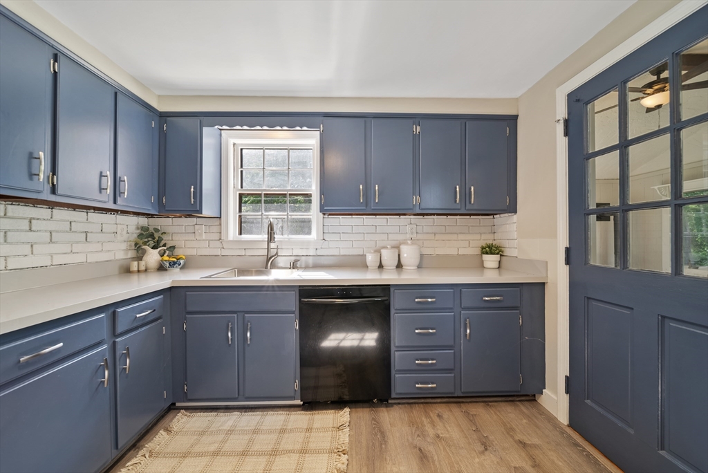 13 Rattlesnake Hill Road Andover, MA 01810 - Photo 16 of 25 a kitchen with stainless steel appliances granite countertop a sink and cabinets