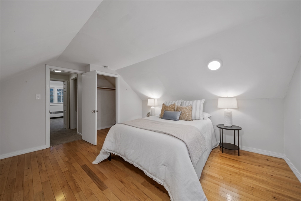 13 Rattlesnake Hill Road Andover, MA 01810 - Photo 20 of 25 a bedroom with a bed and a lamp