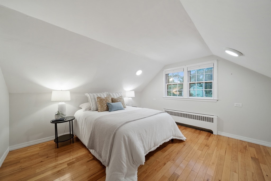 13 Rattlesnake Hill Road Andover, MA 01810 - Photo 21 of 25 a bedroom with a bed and a night stand