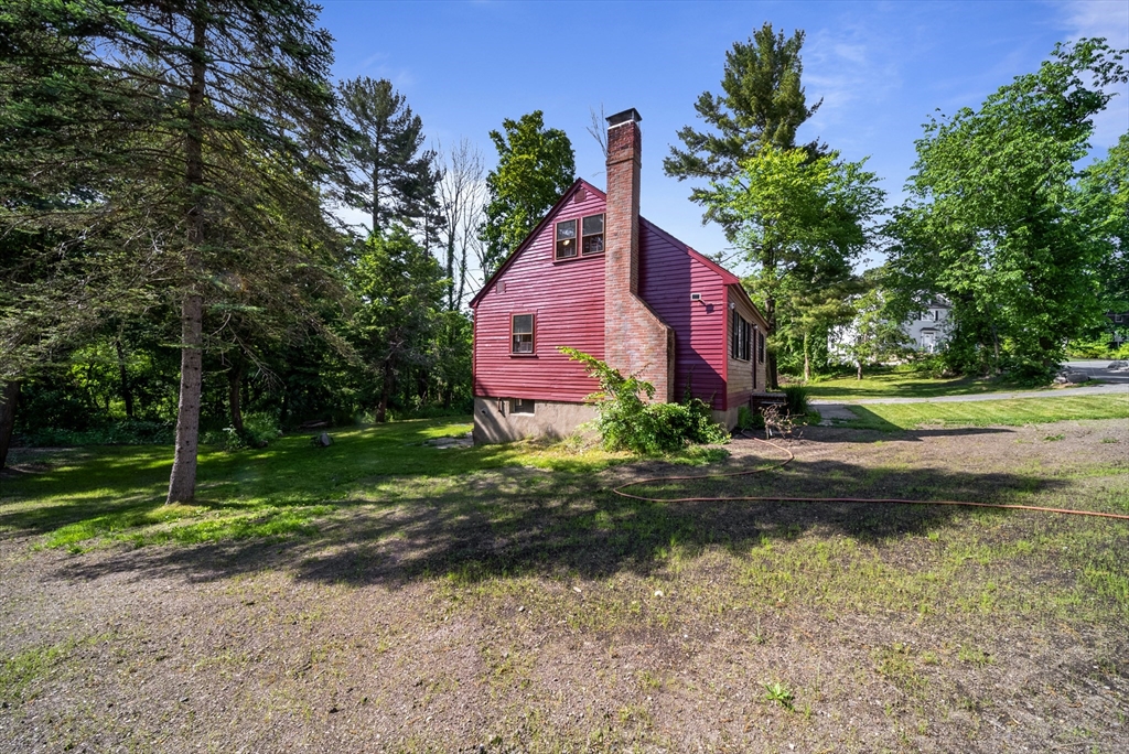 13 Rattlesnake Hill Road Andover, MA 01810 - Photo 3 of 25 a front view of house with yard and green space