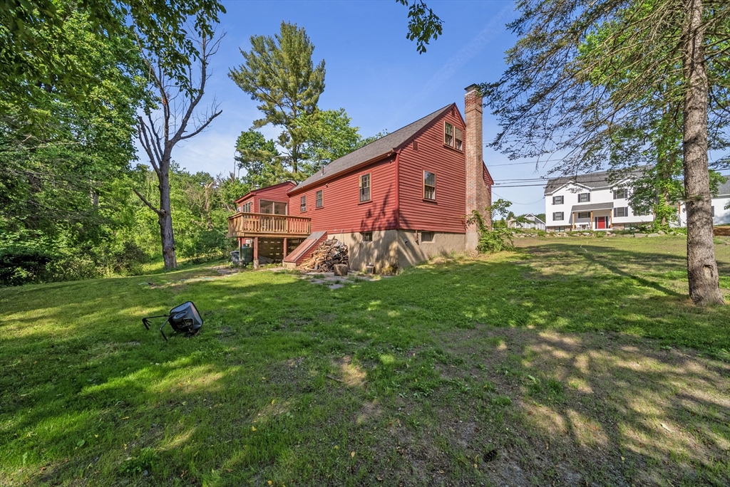 13 Rattlesnake Hill Road Andover, MA 01810 - Photo 4 of 25 a view of a house with a yard