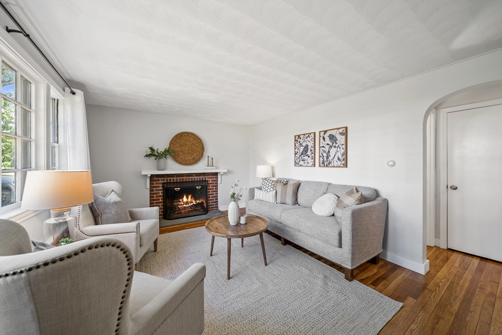13 Rattlesnake Hill Road Andover, MA 01810 - Photo 5 of 25 a living room with furniture a fireplace and a window