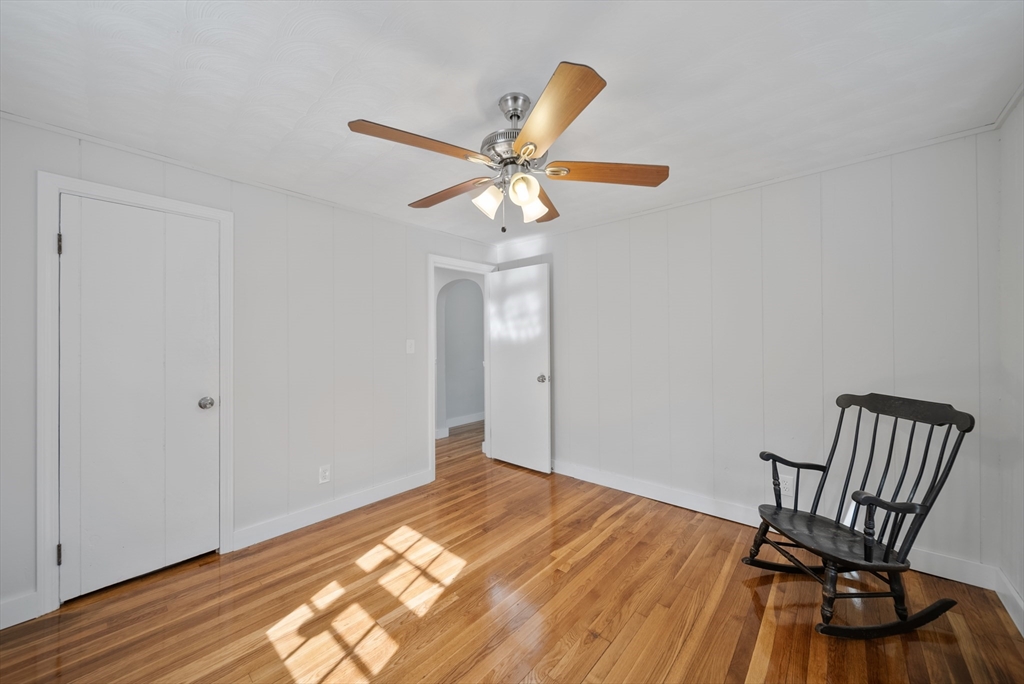 13 Rattlesnake Hill Road Andover, MA 01810 - Photo 10 of 25 a bedroom with a bed and a chandelier