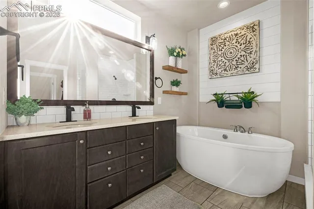 a bathroom with a bathtub and a sink