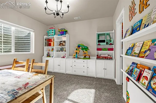 a room that has a bed and a dresser in it