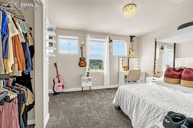 a bed room with a bed and a couch