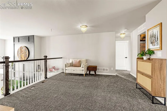 a view of living room kitchen with furniture and stove