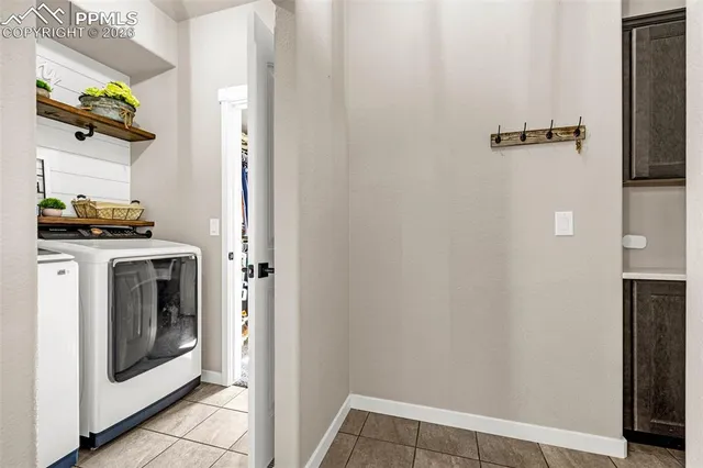 a view of a hallway with washer and dryer