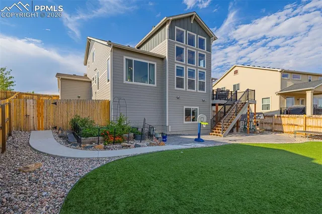 a view of a house with a yard porch and sitting area
