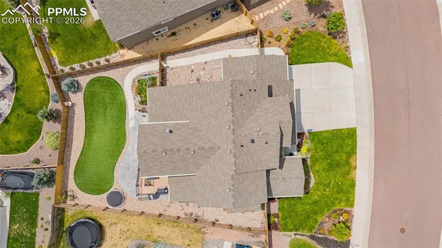 an aerial view of a house with a swimming pool