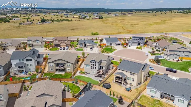 an aerial view of residential building with ocean