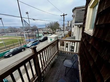 a view of a balcony with chairs