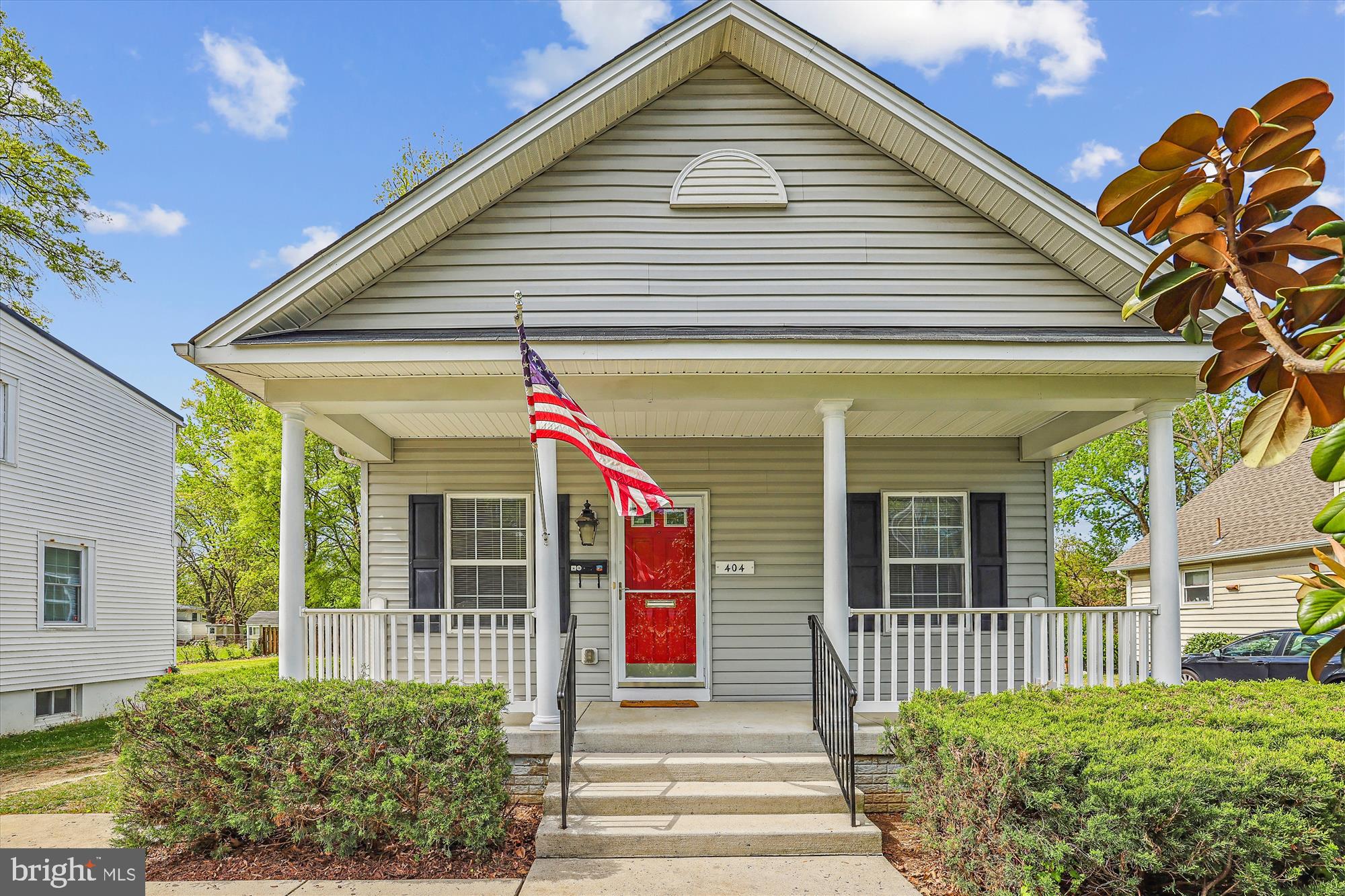 a view of a house with a small yard and plants