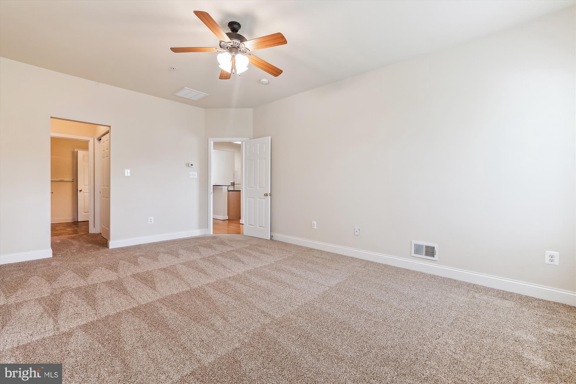 404 Talbott Avenue Laurel, MD 20707 - Photo 12 of 24 a view of an empty room with a ceiling fan