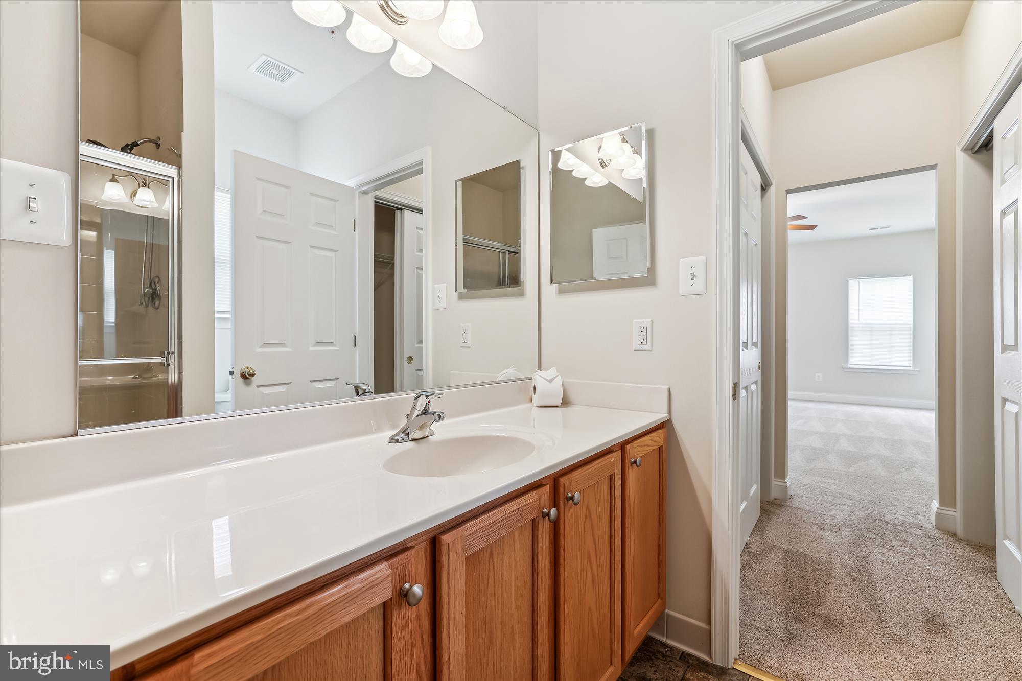 404 Talbott Avenue Laurel, MD 20707 - Photo 8 of 24 a bathroom with a sink and a mirror