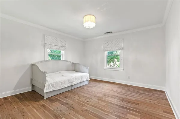 a living room with a bed and a window