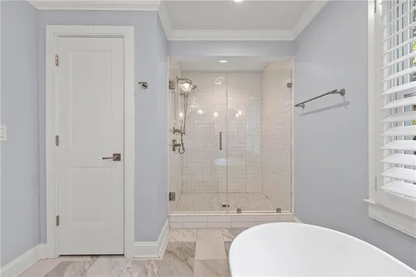 a bathroom with a bathtub shower sink vanity and a mirror