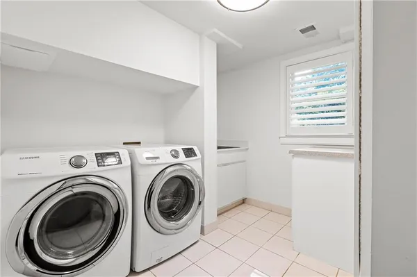 a view of storage and utility room with washer and dryer