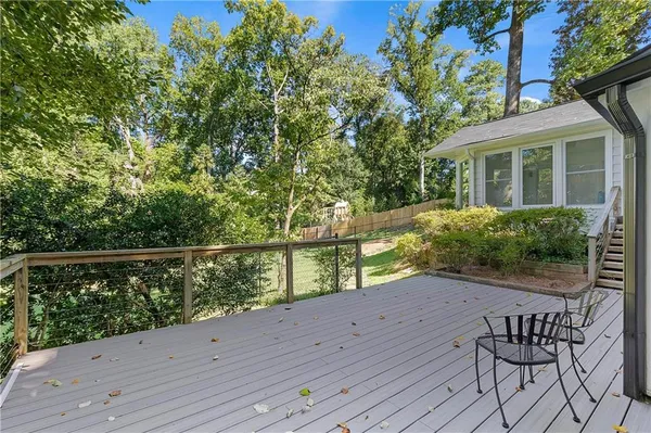 a view of balcony with wooden floor
