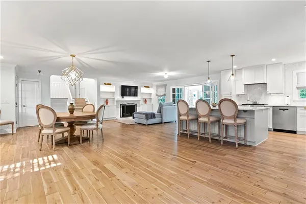 a view of a dining room with furniture and wooden floor