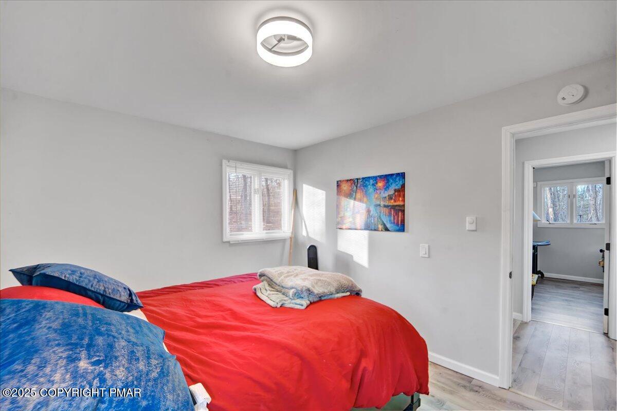 306 Timber Hill Road Henryville, PA 18332 - Photo 12 of 23 a bedroom with a bed and a window