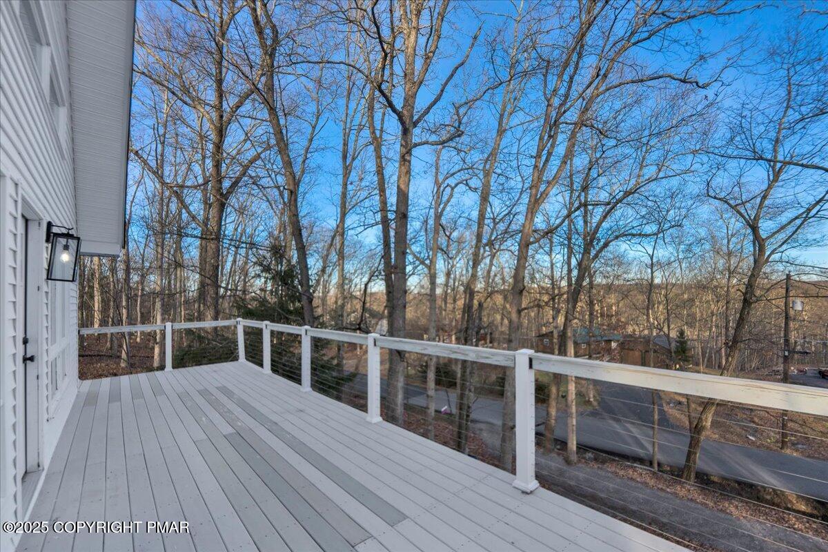 306 Timber Hill Road Henryville, PA 18332 - Photo 18 of 23 a view of backyard with deck and wooden floor