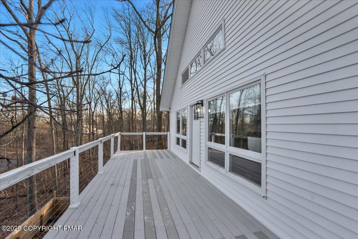 306 Timber Hill Road Henryville, PA 18332 - Photo 19 of 23 a view of a balcony with wooden floor and fence