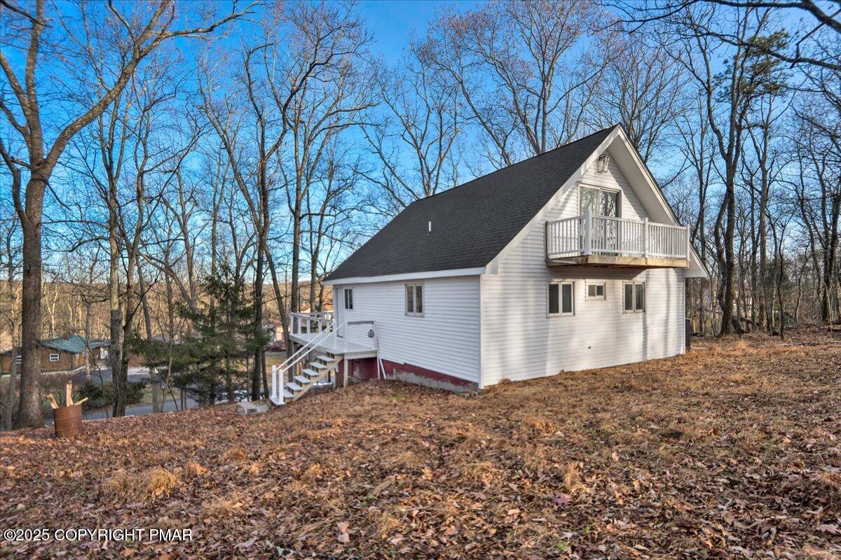 306 Timber Hill Road Henryville, PA 18332 - Photo 20 of 23 a view of a house with a yard covered in snow