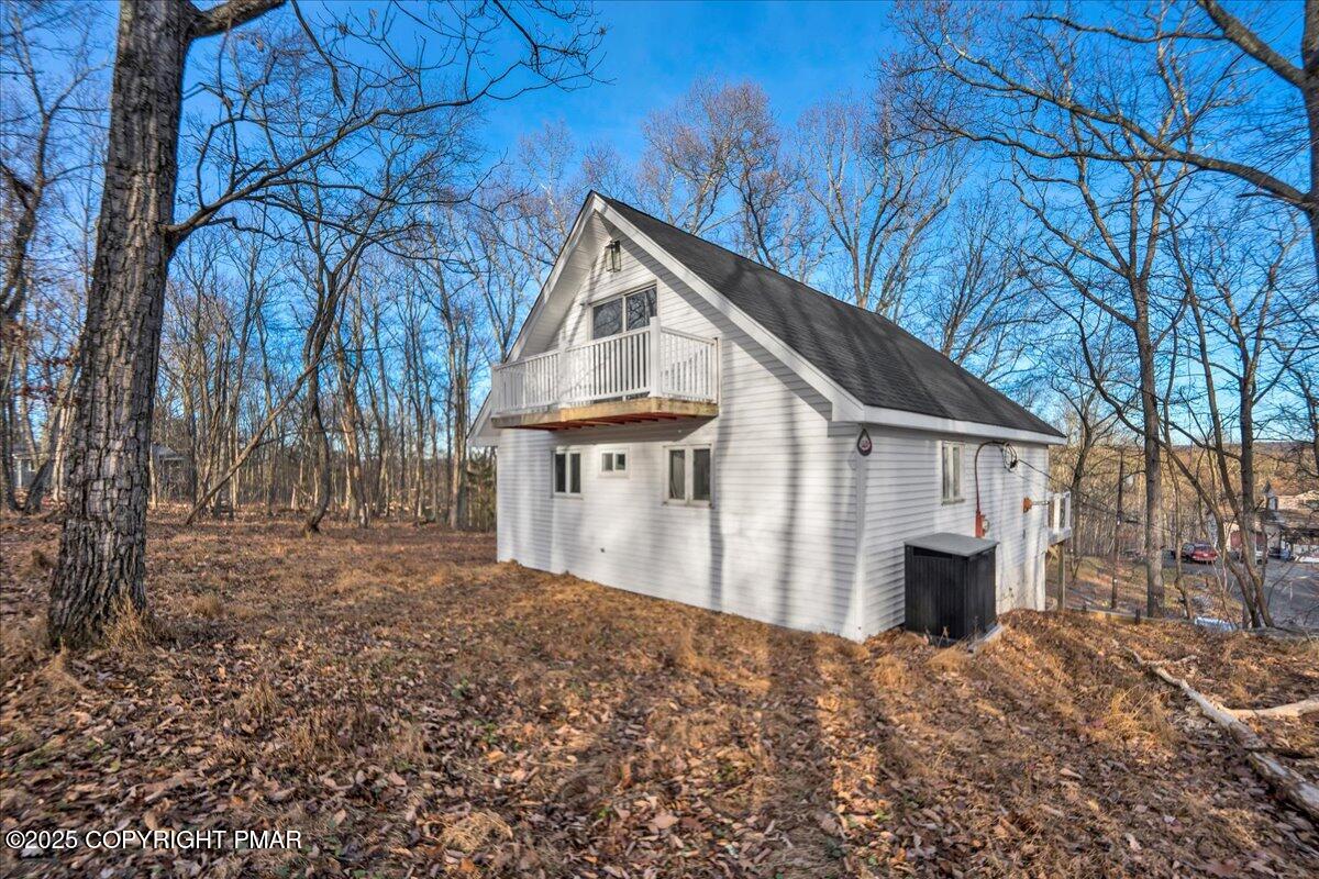 306 Timber Hill Road Henryville, PA 18332 - Photo 21 of 23 a front view of a house with a yard and garage
