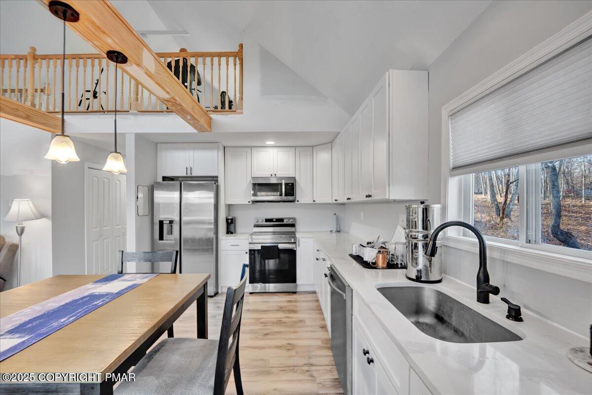 306 Timber Hill Road Henryville, PA 18332 - Photo 4 of 23 a kitchen with granite countertop a sink stainless steel appliances and cabinets