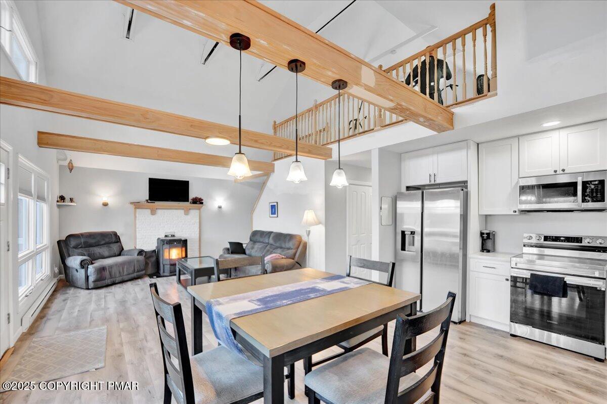 306 Timber Hill Road Henryville, PA 18332 - Photo 5 of 23 a living room with stainless steel appliances kitchen island granite countertop furniture and a kitchen view