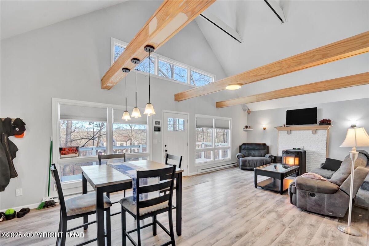 306 Timber Hill Road Henryville, PA 18332 - Photo 6 of 23 a view of a dining room with furniture and chandelier