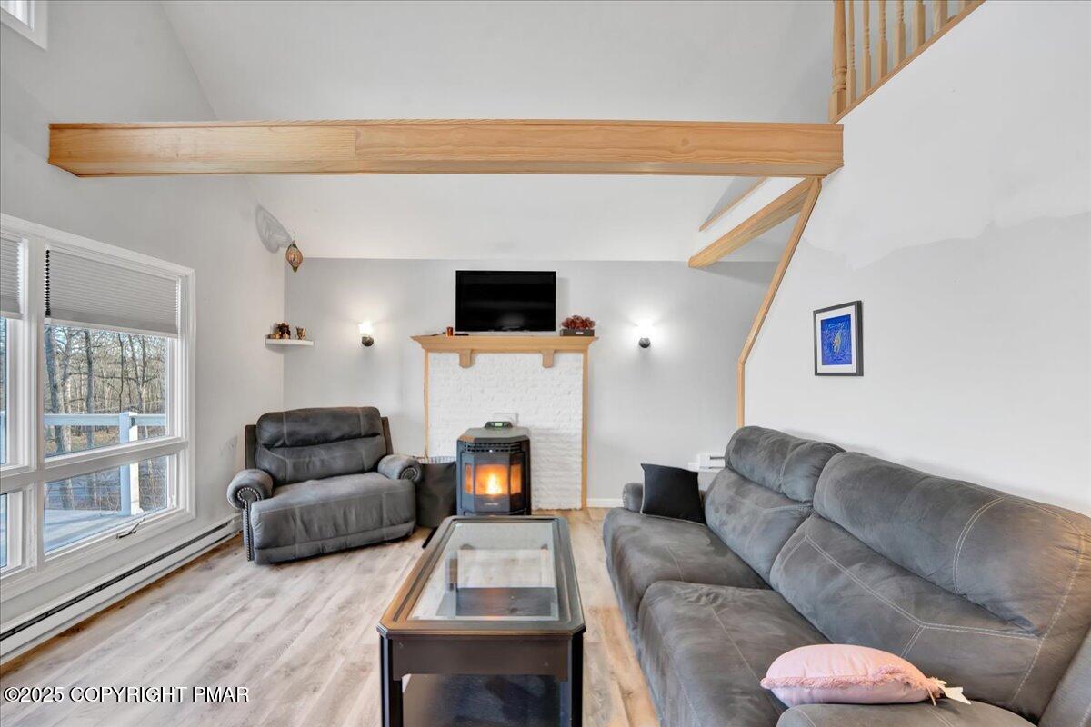 306 Timber Hill Road Henryville, PA 18332 - Photo 7 of 23 a living room with furniture and a fireplace
