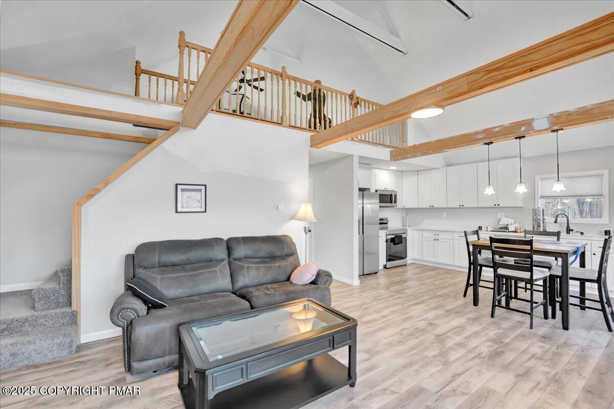 306 Timber Hill Road Henryville, PA 18332 - Photo 8 of 23 a living room with furniture a kitchen view and a dining table
