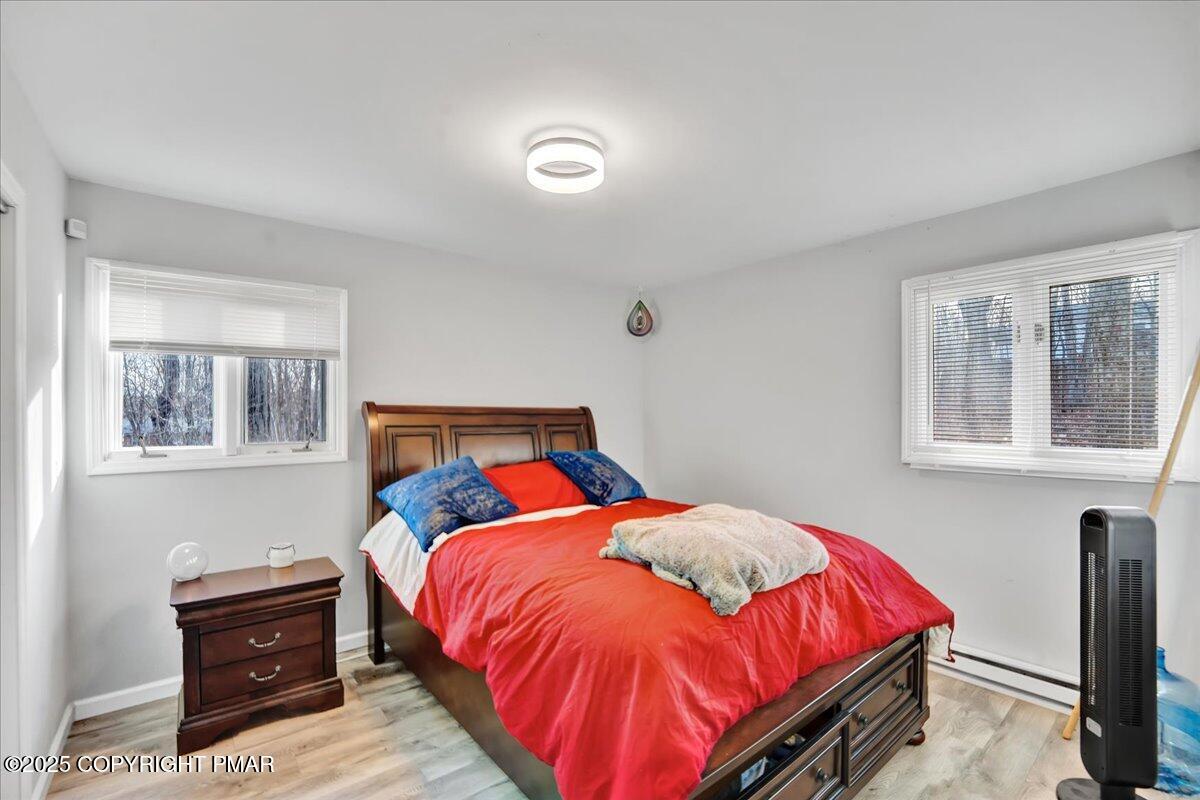 306 Timber Hill Road Henryville, PA 18332 - Photo 10 of 23 a bed sitting in a bedroom next to a window