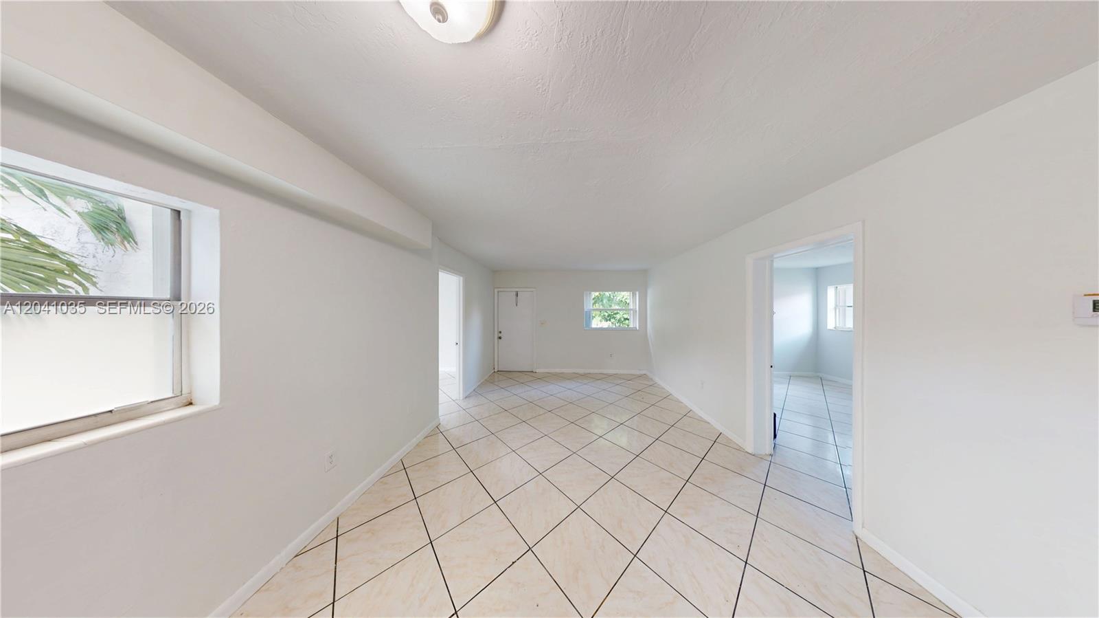 6811 Southwest 16th Street Miami, FL 33144 - Photo 2 of 21 a view of an empty room and window