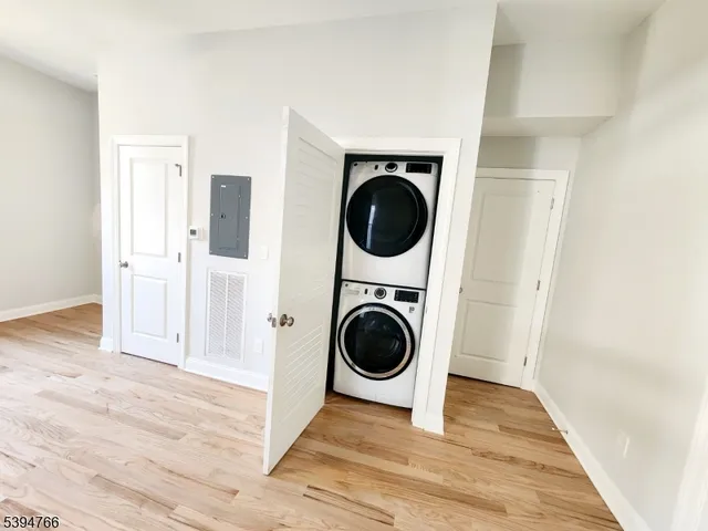 a view of a hallway with washer and dryer