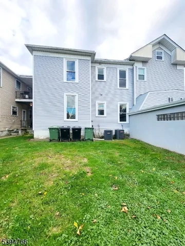 a view of a house with backyard