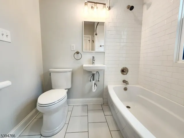 a bathroom with a toilet and a sink