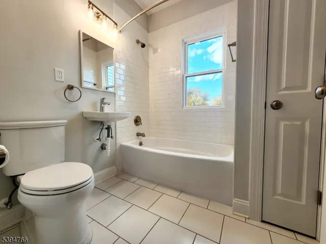 a bathroom with a toilet a sink and a bathtub