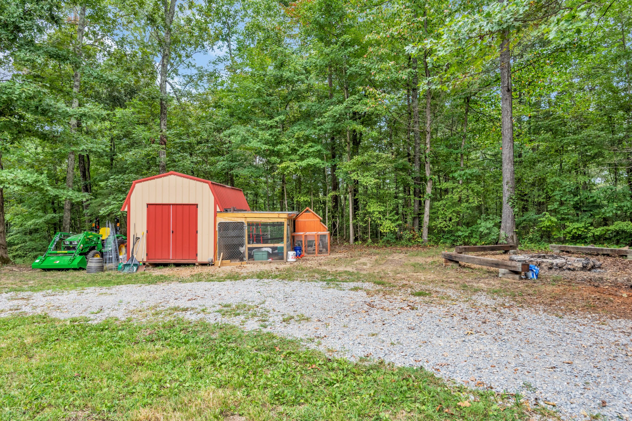 20164 Ben Fly Road Lyles, TN 37098 - Photo 26 of 36 a backyard of a house with a yard and trampoline