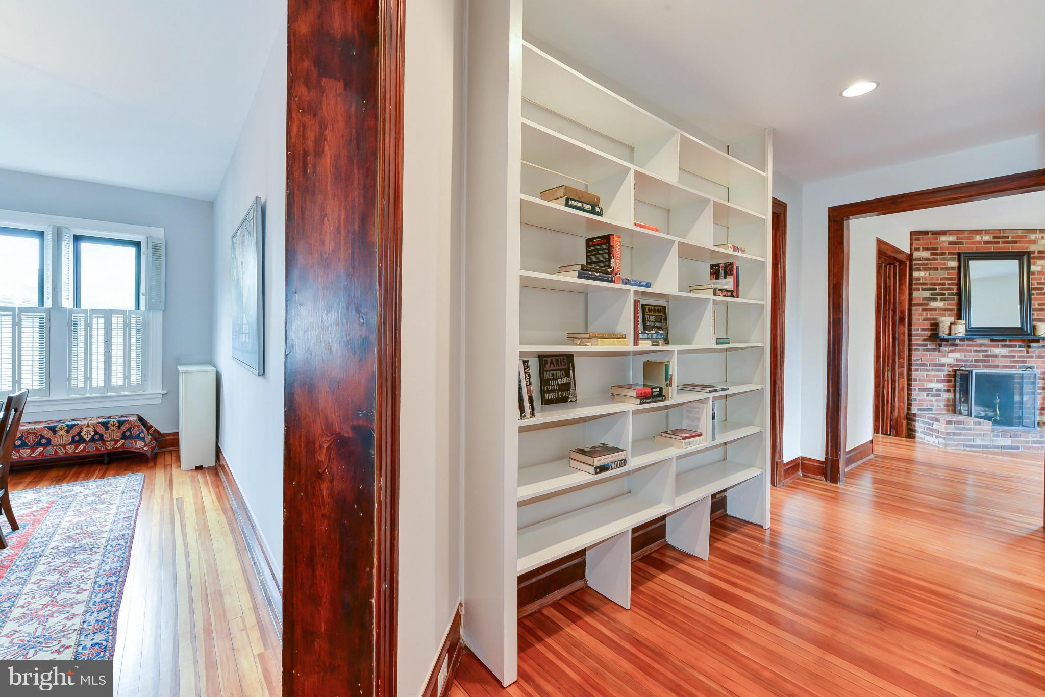 2852 Ontario Road Northwest, Unit 22 Washington, DC 20009 - Photo 18 of 30 a view of a bedroom with wooden floor and windows