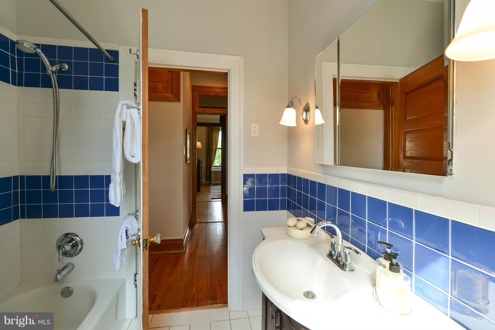 2852 Ontario Road Northwest, Unit 22 Washington, DC 20009 - Photo 23 of 30 a bathroom with a sink and a mirror